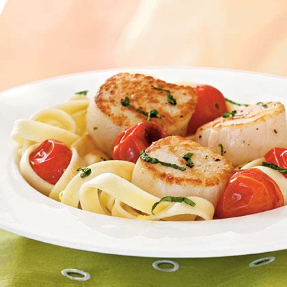 seared-scallops-with-roasted-tomatoes image