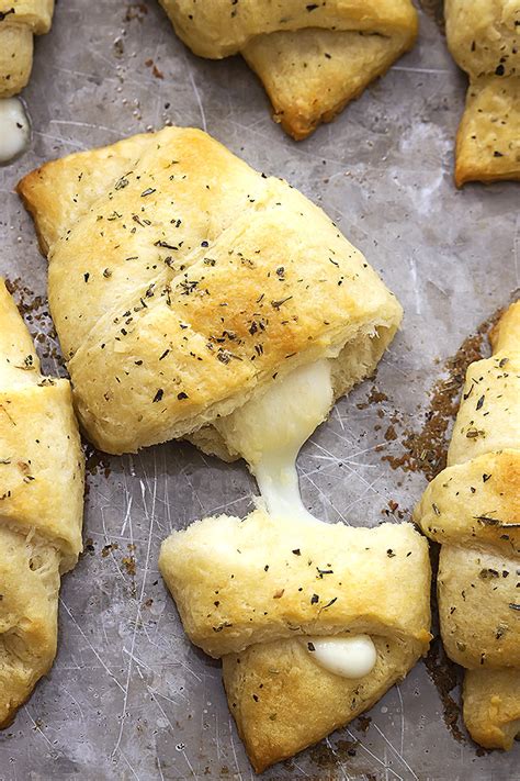 mozzarella-stuffed-garlic-butter-crescents-tiphero image