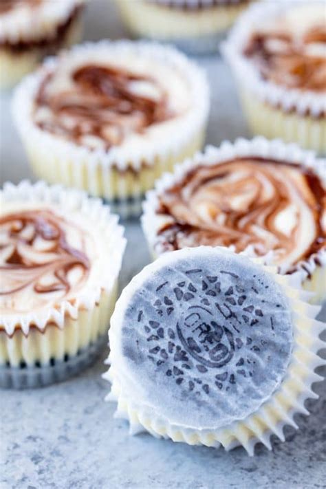 fudge-swirled-oreo-bottom-cheesecake-cupcakes image