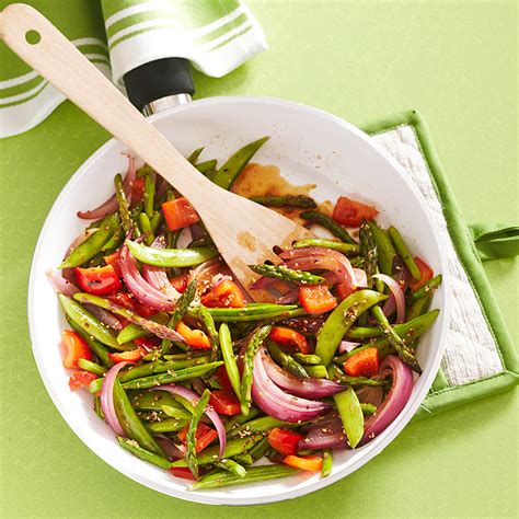 asparagus-snap-pea-stir-fry-recipe-eatingwell image