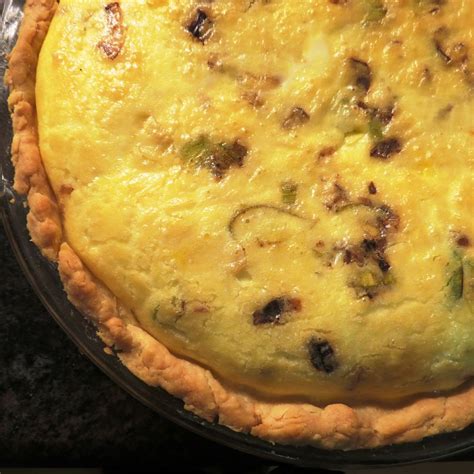 caramelized-leek-tart-quiche-with-bacon-and-brie image