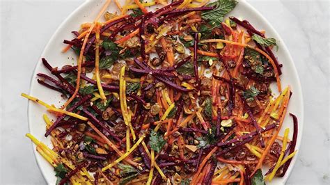 carrot-and-beet-slaw-with-pistachios-and-raisins image