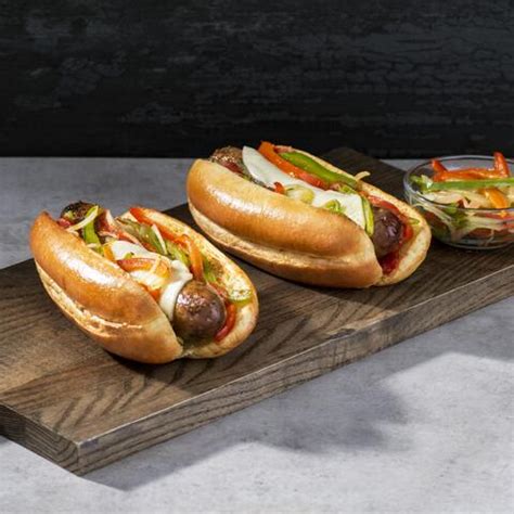 grilled-italian-sausage-on-a-bun-with-cheese-and-peppers image