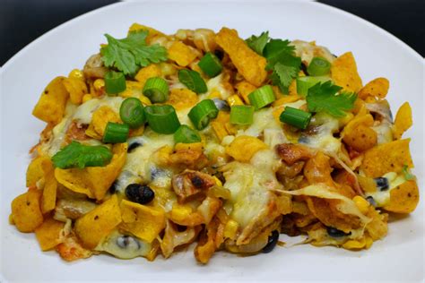 the-ultimate-cheesy-chicken-frito-pie-takes-n-plates image