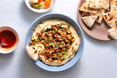 spiced-beef-on-hummus-recipe-the-spruce-eats image