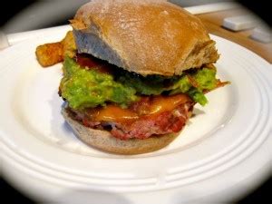 real-simples-cheddar-turkey-burgers-with-mashed-avocado image