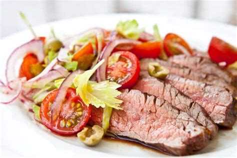 flank-steak-with-bloody-mary-tomato-salad image