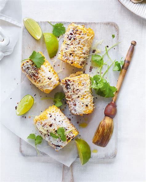cheesy-corn-on-the-cob-recipe-delicious-magazine image