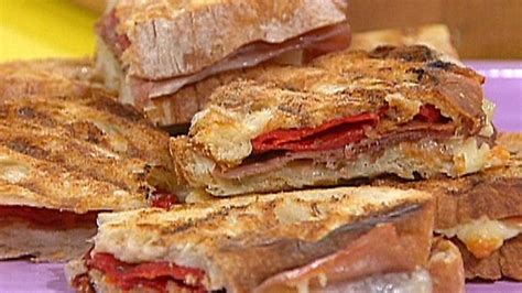 spanish-style-pressed-ham-and-cheese-sandwiches-food-network image