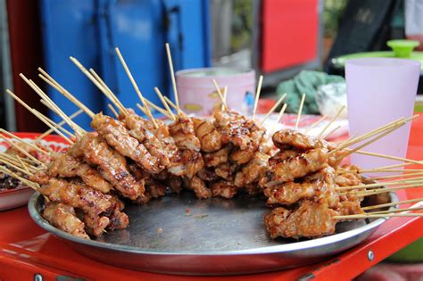 platter-of-thai-style-grilled-pork-sticks-moo-ping image