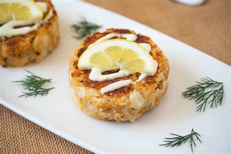 dungeness-crab-cakes-with-lemon-scallion-sauce image