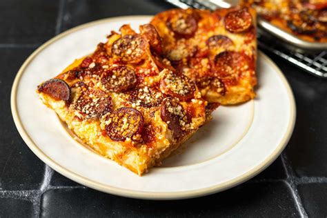 sicilian-pizza-with-pepperoni-and-spicy-tomato-sauce image