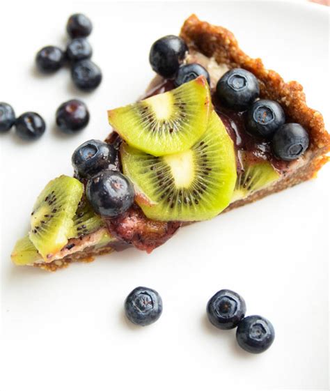 raw-blueberry-and-kiwi-tart-blissful-basil image