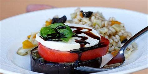 grilled-eggplant-tomato-stacks-eatingwell image
