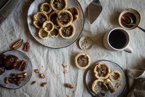 date-maple-butter-tarts-two-red-bowls image