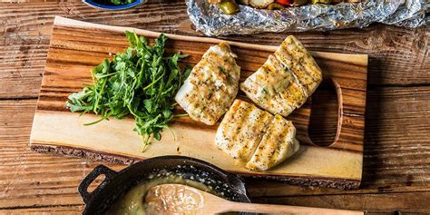 halibut-fillets-with-lemon-butter-sauce-traeger-grills image