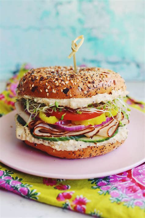 turkey-bagel-sandwich-with-hummus-veggies-grilled image