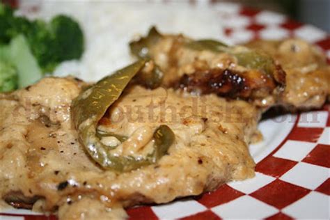 smothered-pork-chops-with-cream-gravy-deep-south image