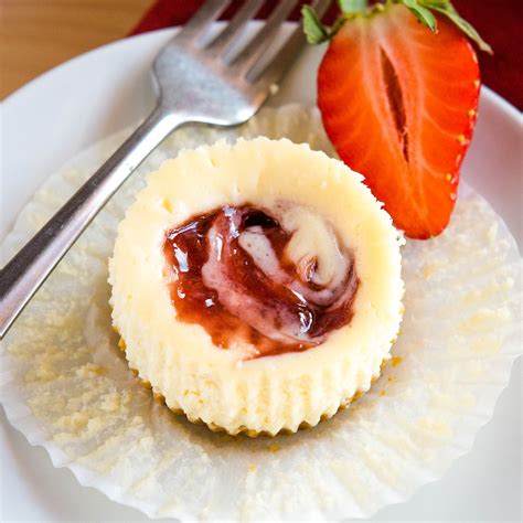 easy-mini-strawberry-swirl-cheesecakes-the-busy-baker image