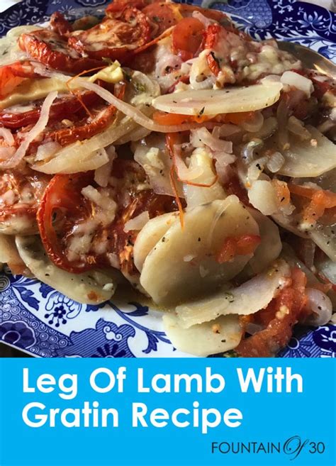 roast-leg-of-lamb-with-potato-onion-tomato image