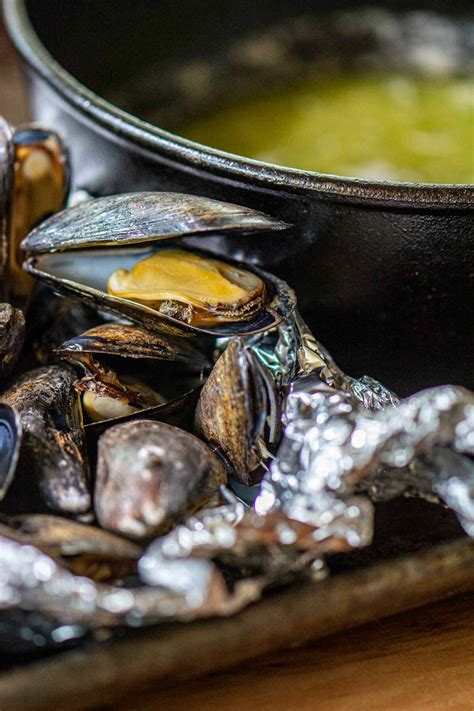 grilled-mussels-in-a-foil-pack-garlic-wine-butter image