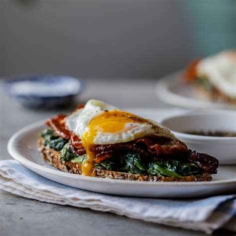 bacon-egg-and-creamed-spinach-breakfast-toast image