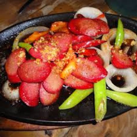 sauteed-sizzling-hotdogs-in-tomato-sauce image
