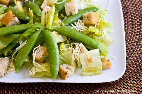 caesar-salad-with-sugar-snap-peas-cooking-on-the-side image