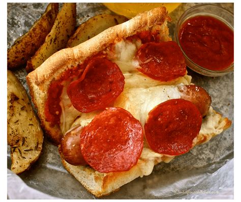pesto-pepperoni-pizza-dogs-on-garlic-bread image