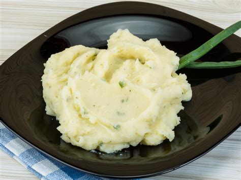 mashed-potatoes-with-green-onions-and-parmesan image