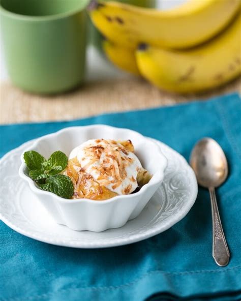 baked-bananas-with-toasted-coconut-a-couple-cooks image