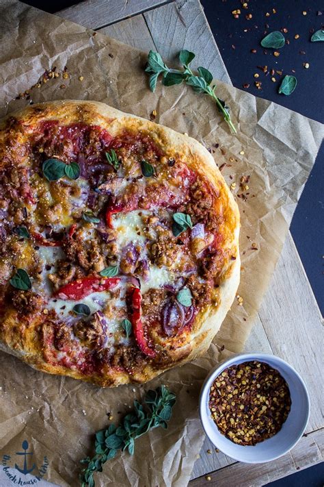 spicy-sausage-pizza-with-roasted-red-pepper-and-onion image