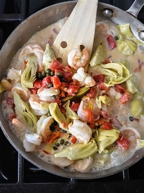 shrimp-pasta-with-roasted-red-peppers-and-artichokes image