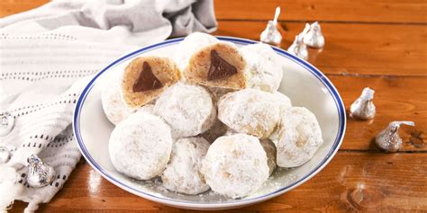 best-chocolate-kisses-snowball-cookies-recipe-delish image
