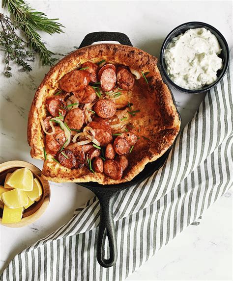 parmesan-herb-dutch-baby-with-sausage-onions image