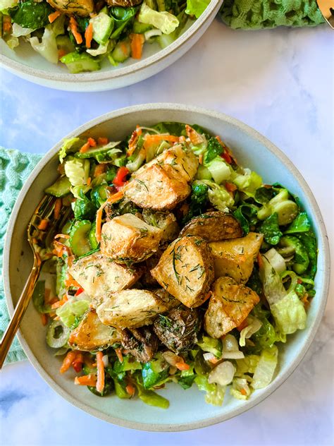 salad-topped-with-roasted-potatoes-baked-by-melissa image