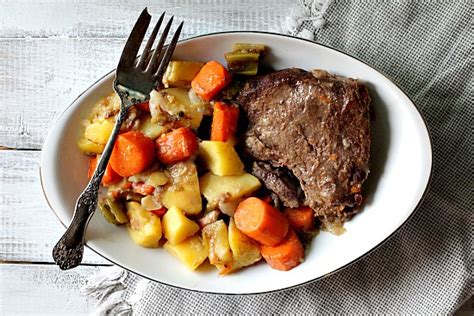 pot-roast-dinner-old-fashioned-roast-beef-with-gravy-cooking image