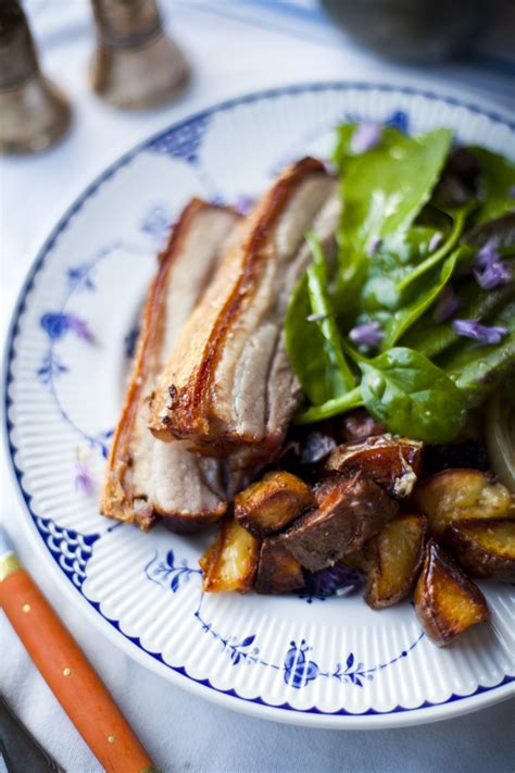 crispy-pork-belly-with-roast-potatoes-and-salad-greens image