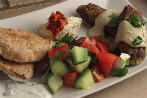 koftas-with-greek-salad-and-sauces-healthy-mama image