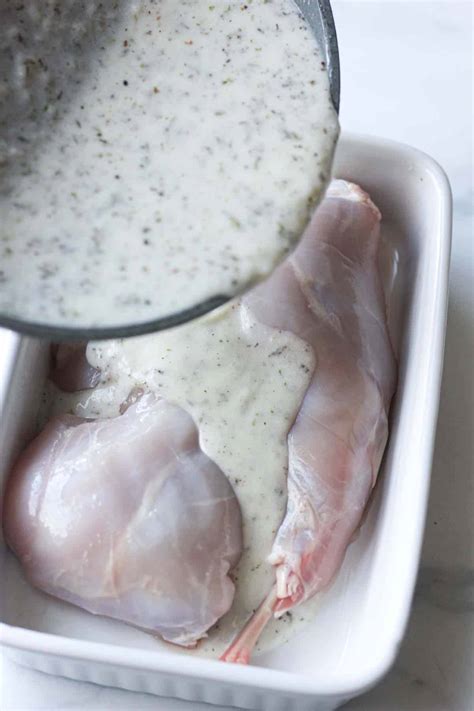 italian-style-oven-baked-rabbit-legs-in-cream-garlic-sauce image