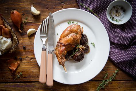 braised-rabbit-with-red-wine-prunes-and-thyme image