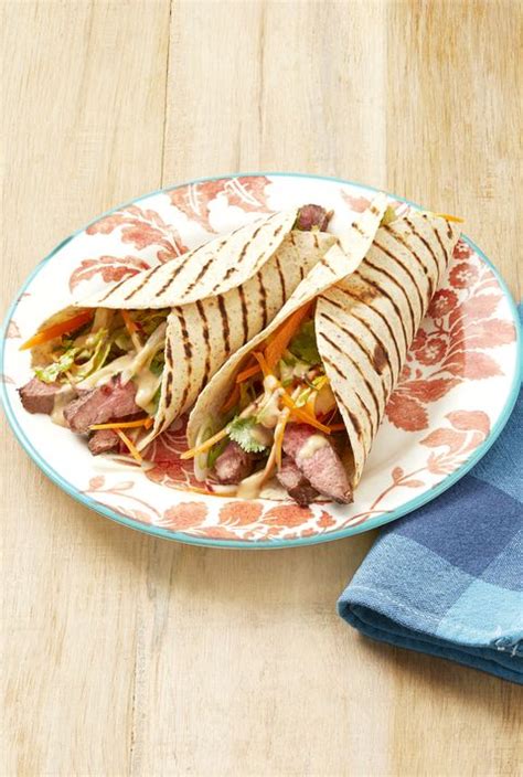 grilled-steak-wraps-with-peanut-sauce-the-pioneer image
