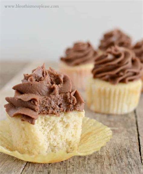vanilla-cupcakes-with-milk-chocolate-icing-and-a-kitchen image