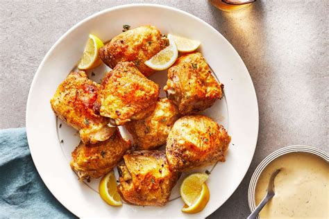 baked-lemon-garlic-chicken-thighs-recipe-food-wine image
