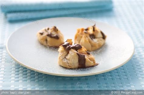 strawberry-ricotta-phyllo-purses-with-chocolate-syrup image