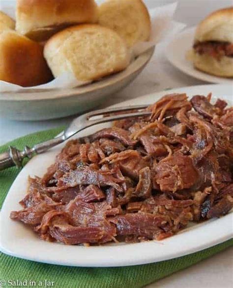 easy-to-serve-slow-cooker-pulled-ham-with-a-golden image