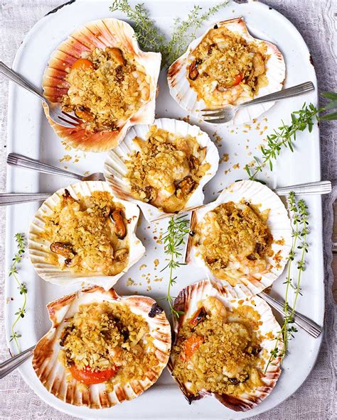 scallop-gratins-with-sea-bass-mussels-and-prawns image