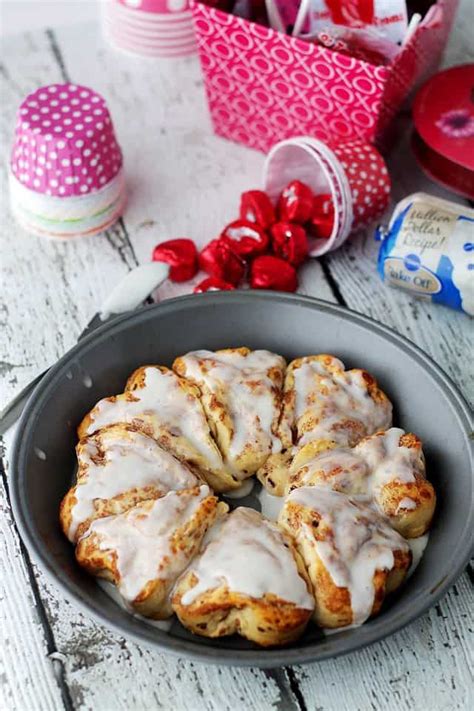 heart-shaped-cinnamon-rolls-and-valentine-cookie image
