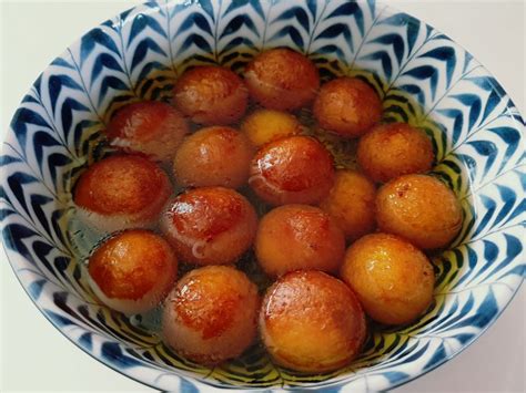 gulab-jamun-milk-balls-in-a-rosy-sugar-syrup-the image