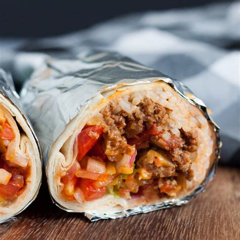 skillet-beef-burrito-recipe-with-rice-and-beans-eating image